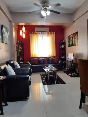 a living room with a couch and a table at Sarasota Residential Resort cluster 4 Unit 6B and 6C by Manny Newport Blvd, across NAIA T3 & near Resorts World Manila, Pasay City in Manila