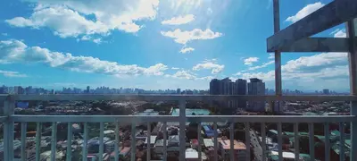 a view of a city from a balcony at Spacious One Bedroom 20888 in Manila