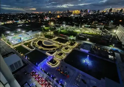 an aerial view of a city at night at Pandora’s Nest in Manila