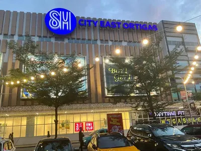 a building with cars parked in front of it at Pandora’s Nest in Manila