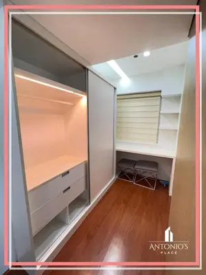 a room with a closet with a desk and a mirror at Panoramic View of City 1BR Loft Unit FREE WIFI & NETFLIX at Fort Victoria BGC in Manila