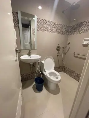 a bathroom with a toilet and a sink at Hotel Sogo Edsa Cubao in Manila