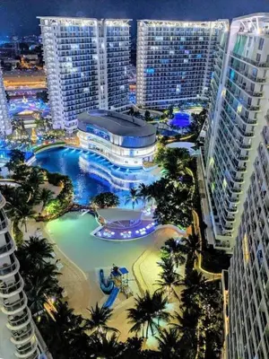 a view of a resort with a pool and buildings at Azure Urban Resort in Manila