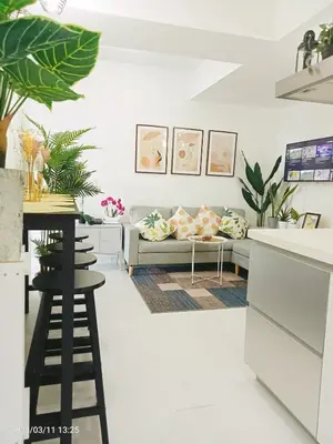 a living room with a couch and a table at S-A-F-E Haven Resort Staycation in Manila