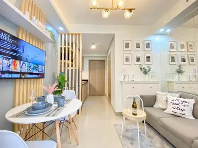 a living room with a couch and a table at Will’s Place @ Shore2 Residences Mall of Asia in Manila