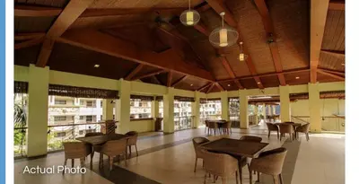 a room with tables and chairs in a building at Lovely 2 BR Condo with FREE Secured Parking in Manila