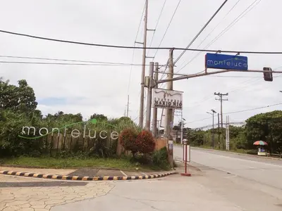 a sign for a morgue on the side of a road at Affordable Tagaytay Monteluce 2 BR Loft with pool 32 in Lalaan Primero
