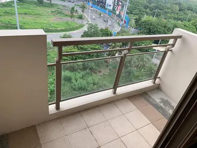 a balcony with a view of a street at Ramiro Haven Staycation in Manila