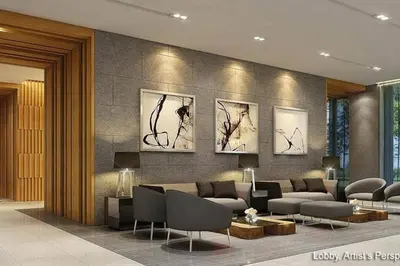 a lobby with a couch and paintings on the wall at S Residences MOA Condo Stunning Boutique Hotel Type T1 in Manila