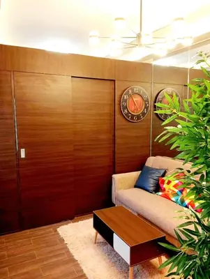 a living room with a couch and a table at Air Residences Makati Condo Elegant Grand Hotel Type in Manila
