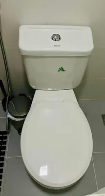 a bathroom with a white toilet in a room at Modern Condotel Stay with Netflix, Kitchen & Washer, Near MRT Boni in Manila
