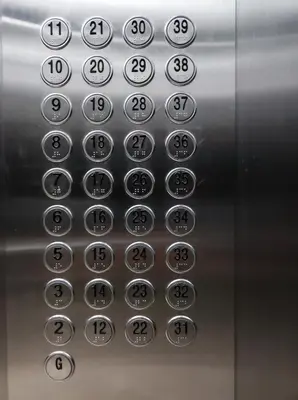 an elevator button with numbers on it at Schönes Apartment mit Pool-Nutzung in Manila