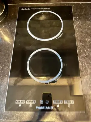 a close up of a metal object with a charger at Coast Residences, Roxas Blvd, Pasay City in Manila
