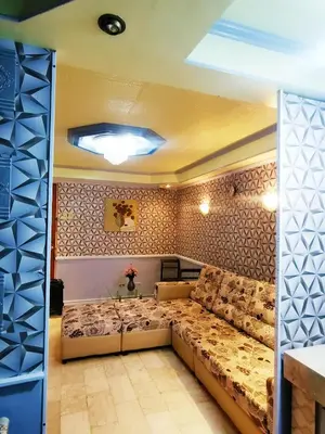 a living room with a large couch in a room at City Tower Condominium Transient Inn in Manila