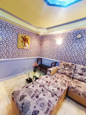 a bedroom with a bed and a wall at City Tower Condominium Transient Inn in Manila