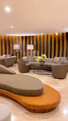 a large living room with couches and a table at SHORE RESIDENCE D4 shortwalk MALL OF ASIA NEAR AIRPORT in Manila