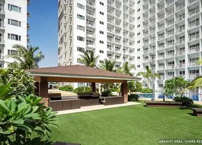 a gazebo in front of a large apartment building at NJ's Place, Shore 1 Residences, MOA Complex, Pasay City, Philippines in Manila