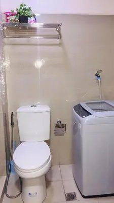 a bathroom with a toilet and a sink at NJ's Place, Shore 1 Residences, MOA Complex, Pasay City, Philippines in Manila