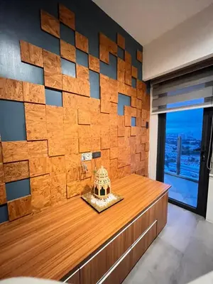 a bathroom with a wooden wall with a cake on a counter at 1 bedroom Service Aprtmnt 2pax allows other 4pax 25011 in Cubao Quezon City in Manila