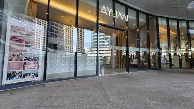 a store front of a building with large glass windows at Heart of Makati, Fully furnished condo, cbd central location in Manila