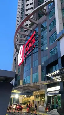 a large building with a large sign on it at Grand Riviera Suites Comfy Condo near US Embassy Manila Bay Roxas Blvd Ermita Manila in Manila