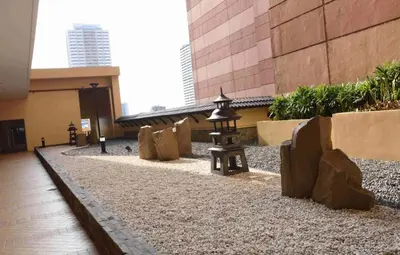 a courtyard with a lantern in a building at Grand Riviera Suites Comfy Condo near US Embassy Manila Bay Roxas Blvd Ermita Manila in Manila
