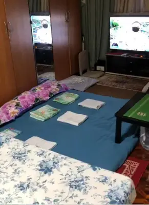 a room with a blue blanket with napkins on it at THE MANSION - 20 PAX LUXURY Near AIRPORT in PASAY in Manila