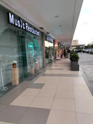 an empty mall with a music and retail store at Cozy 619 shore2 residence tower2 near MOA in Manila
