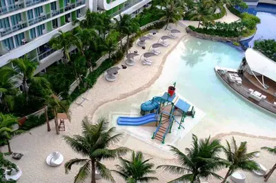 a resort pool with a slide and a water park at AZURE URBAN RESORT Maldives tower in Manila