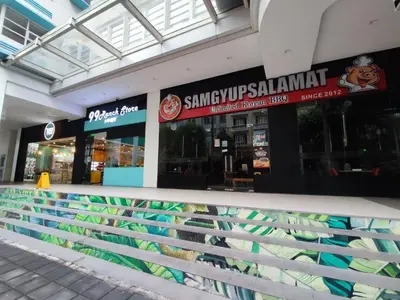 a store with a bunch of signs on the front of it at TWO PALMTREE VILLAS NEWPORT BOULEVARD NEAR NAIA 3 PASAY CITY in Manila