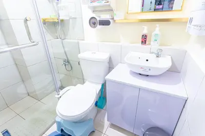a bathroom with a toilet and a sink at Pandora's Nest in Manila
