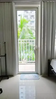 an open door in a room with a window at Shore Residence D2 - shortwalk Mall of Asia Near Airport in Manila