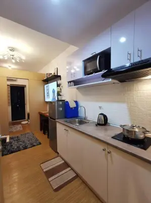 a kitchen with a sink and a counter top at Lot's Pad nr BGC in Manila