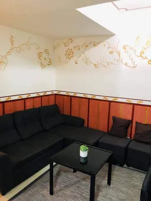a living room with a couch and a table at Azure Beach Resort A5 Near Mall Airport in Manila