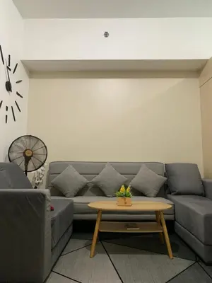 a living room with a couch and a coffee table at Amazing Condo at SMDC Light Residences Boni Avenue Mandaluyong in Manila
