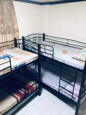 two bunk beds are in a room withthritisthritisthritisthritisthritisthritisthritisthritis at THE MANSION - NEAR AIRPORT BIG FAMILY Lodge in Manila