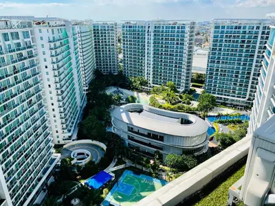 an aerial view of a city with tall buildings at Azure Pool View with Balcony, WiFi and Netflix in Manila