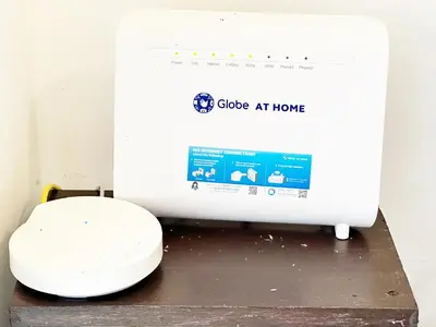 a toilet sitting on a table next to a computer at SweetSuites at Pine Crest #T1-526 in Manila