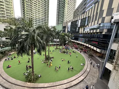 a group of people in a park in a city at SweetSuites at Pine Crest #T1-526 in Manila