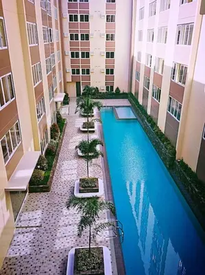 an overhead view of a swimming pool in a building at Stanford Suites 2 Lilian in Silang