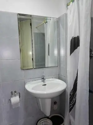 a bathroom with a sink and a mirror at 5 Years Legit Staycation Infront of Moa, Arena, Smx, Ikea, Sea Residences Tower A, Near Dfa Macapagal, Ayala Mall, World Trade, Naia123 in Manila