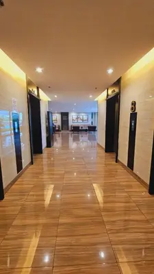 an empty hallway of a building with wooden floors at Awesome Value, Great Location in Manila