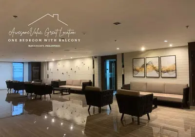 a lobby with a waiting room with couches and chairs at Awesome Value, Great Location in Manila