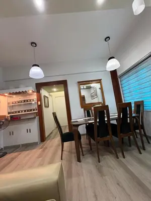 a living room with a dining room table and chairs at 3BR 70sqm Free internet, Penthouse unit in Ermita, Manila near US Embassy in Manila