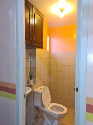 a bathroom with a toilet and a sink at Pet Friendly Transient near Villa Ardin in Cainta