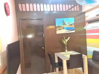 a dining room with a table and chairs at Pet Friendly Transient near Villa Ardin in Cainta