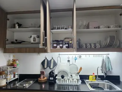 a kitchen with a sink and a counter top at Jana@ShoreC2 in Manila