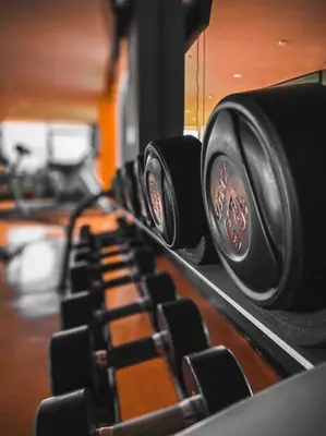 a row of black seats in a gym at The Radiance Manila Bay - Modern 1-Bedroom Condo with View in Manila