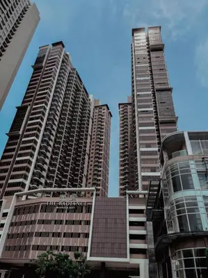 a group of tall buildings in a city at The Radiance Manila Bay - Modern 1-Bedroom Condo with View in Manila