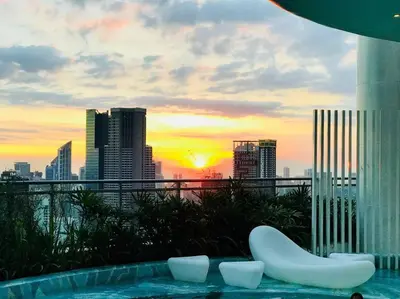 a swimming pool with a view of a city skyline at Acqua Private Residence Livingstone Tower Condo Unit with Free Wifi in Manila
